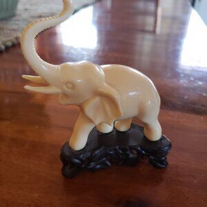 Vintage Figurine of Elephant with trunk raised which symbols good fortune